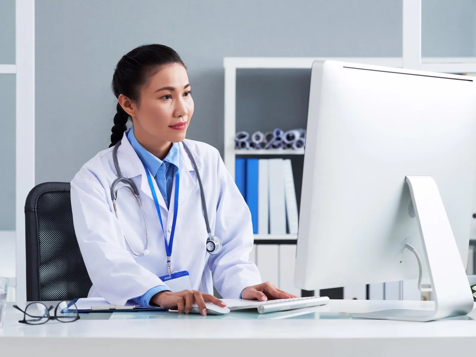 Doctor looking at her computer
